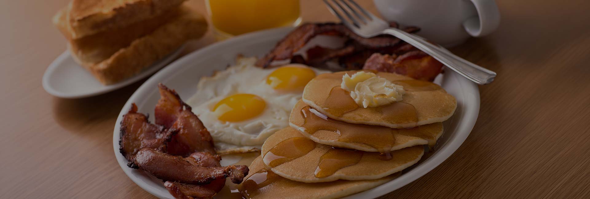 Pancakes, eggs sunny side up and fried bacon served at E.J.'s Diner in Wausau, WI.