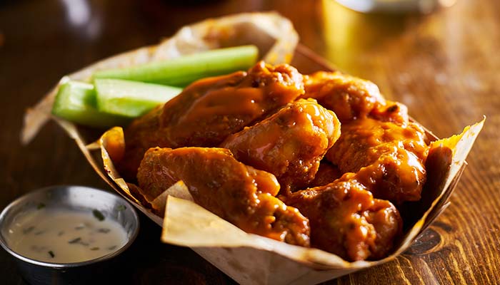 Basket of buffalo chicken wings with celery, ranch, and perfect for lunch in Wausau WI.