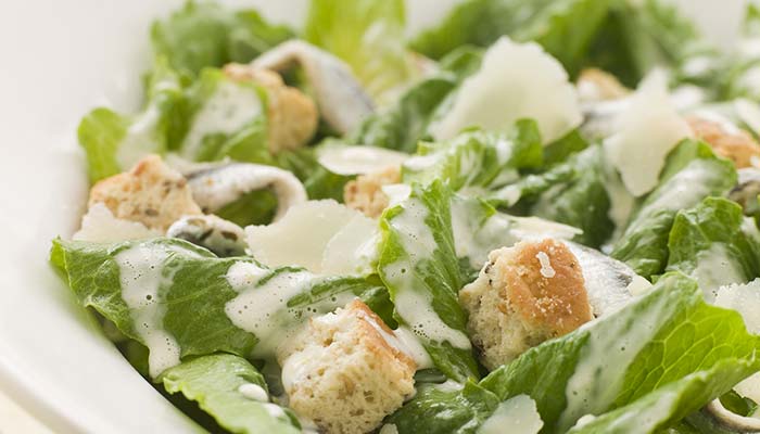 Close-up of Caesar salad, perfect for lunch in Wausau WI, with romaine, croutons, and Parmesan.