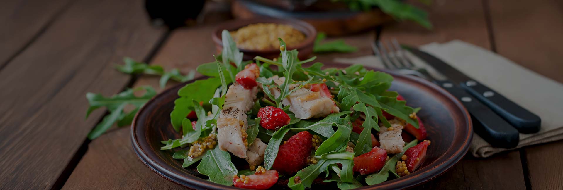 Fresh garden salad topped with strawberries served at E.J.'s Diner in Wausau, WI.